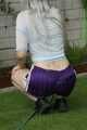 Watch Chloe watering the Garden enjoying her shiny nylon Shorts