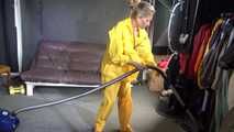 Watching sexy SANDRA vacuum cleaning the studio wearing a sexy yellow rainwear combination (Video)