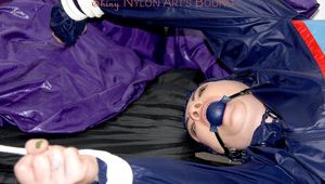 Jill tied and gagged in shiny nylon rainware