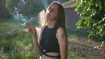 18 y.o. Margarita is smoking three cork 120mm cigarettes outdoors