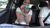 Nina gagged with medical strips in the car