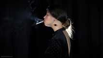 Irina is smoking 100mm cigarette in the dark room