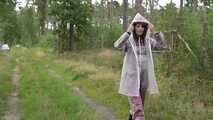 Miss Petra takes a walk in an AGU rain suit, transparent rainsuit and rubber boots (looped version)