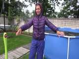 Watch Sandra enjoying Shower in her shiny nylon Downwear in the Garden