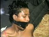 BLACK SHONDA IS WRAP TAPE GAGGED & BOUND UP WITH BLACK ELECTRICAL TAPE (D33-10)