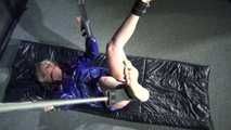 Watching Pia wearing a supersexy shiny nylon shorts lying on the floor being tied and gagged with ropes and a ballgag on the ceiling (Videos)