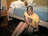 PUNK GIRL MELA IS BAREFOOT, TOE-TIED, TAPE GAGGED THEN TAPES, STUFFS MOUTH AND CLEAVE GAGS HERSELF (D57-13)