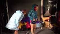 Watching sexy Stella and Sandra wearing a sexy shiny nylon shorts putting on several shiny nylon down jackets (Video)