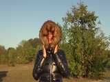 Watch Sandra enjoying her shiny nylon Downjacket at very warm Wearther outside