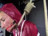 Watch Sandra bound gagged and noosed wearing her shiny nylon Rainwear