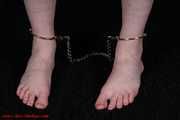 Lady barfeet cuffed