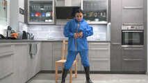 Miss Amira in Farmerrain raingear bound and gagged on a chair