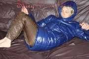 Sexy Sonja changing clothes to a brown down pants and a blue down jacket and lolling on the sofa (Pics)