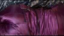 Watching Lucy preparing her sofa with a black shiny nylon cloth for lolling with a sexy purple downsuit on the sofa (Video)