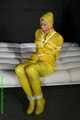 Get Pictures of Pia bound and gagged in her yellow shiny nylon Rainwear