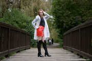 Miss Petra in hot vinyl skirt, overknee boots and raincoat at the photo shoot