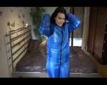 Jill putting on a sexy blue shiny nylon down suit and lolling on bed (Pics)