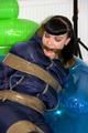 Jill tied and gagged in a shiny nylon down jacket 