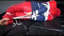 SANDRA tied, gagged and hooded on the floor wearing a supersexy oldschool red/blue down suit (Video)