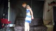 Red haired Woman bound and gagged in a shiny wetlook Cheerleader Dress