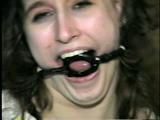 ERICA IS RING GAGGED, MOUTH STUFFED, CLEAVE GAGGED & TIED WITH BLACK NYLON ROPE (D36-10)