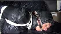 Sexy Sandra being tied and gagged with ropes on a sofa wearing a sexy black down pants and a black shiny nylon down jacket (Video)