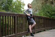 Miss Petra in a hot vinyl skirt, high heels and transparent blouse at photo shooting