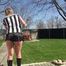 Watching Pia sweeping the terrace wearing a sexy black shiny nylon shorts, a striped top and black rubber boots (Video)