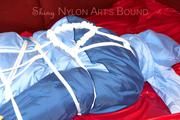 Lucy tied and gagged with a rope and a gag on a red sofa wearing an oldschool blue downwear combination (Pics)