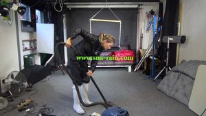 Watch Sandra cleaning the Studio wearing shiny nylon Rainwear and white Rubberboots