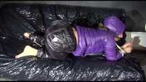 Sandra tied and gagged on a sofa wearing a shiny nylon down jacket and a rain pants (Video)