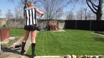 Watching Pia sweeping the terrace wearing a sexy black shiny nylon shorts, a striped top and black rubber boots (Video)