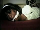 26 YR OLD BLACK BANK TELLER IS HOG-TIED, CLEAVE GAGGED AND HANDGAGGED WHILE STRUGGLING ON THE BED (D52-12)