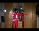 Lucy wearing a sexy red rainwear catsuit posing infront of the mirror (Video)