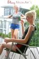 Jenny and Yvonne having a good time together wearing shiny nylon shorts and tops (Pics)