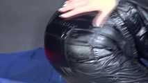 Watching sexy Sandra wearing a supersexy black shiny nylon rainsuit playing with babyoil (Video)