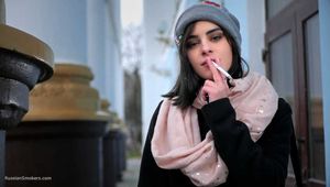 Sweet Karina is smoking 100 mm cigarette in this fetish video