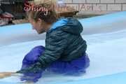 Watching Sandra wearing a sexy blue shiny nylon rainwear bib and a green down jacket while taking a sunbath and a bath in the swimming pool  (Pics)