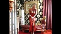 Miss Francine bound and gagged in a long red Latex dress  making off video part 2
