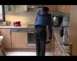 Jill wearing a super thin black rain pants and a black/blue down jacket while cleaning the kitchen (Video)