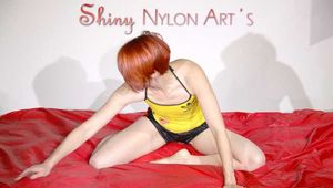 SONJA wearing a supersexy black shiny nylon shorts and a yellow top preparing her bed (Pics)