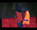 DESTINY wearing a sexy blue/red shiny nylon rain suit putting on a life jacket and posing (Video)