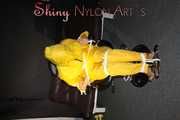 Sandra being tied and gagged on a hairdresser´s chair wearing sexy yellow shiny nylon rainwear being double hooded (Pics)