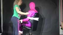 Sexy Pia tied and gagged with ropes and a clothgag on a hairdresser´s chair wearing a sexy pink shiny nylon downsuit (Video)