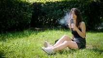 Arina is smoking 120mm cigarettes outdoors