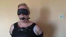 Cuffed and gagged on a chair 2