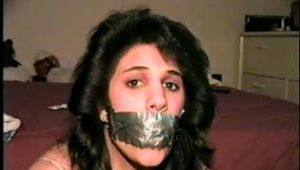 19 Yr OLD LATINA HOUSEWIFE IS BALL-TIED WITH TAPE AND ROPE TAPE GAGGED, CLEAVE GAGGED AND BLINDFOLDED WEARING LINGERIE (D60-3)