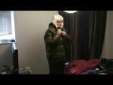 Blonde archive girl put bedding on wearing sexy shiny nylon rainwear (Video)