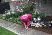 Watching Aiyana wearing supersexy pink shiny nylon rainwear while planting flowers in the garden (Pics)