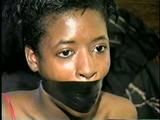 BLACK SHONDA IS WRAP TAPE GAGGED & BOUND UP WITH BLACK ELECTRICAL TAPE (D33-10)